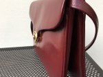 Sac - pochette bordeaux, au style faussement classique !