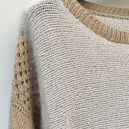 Pull nuancé beige.